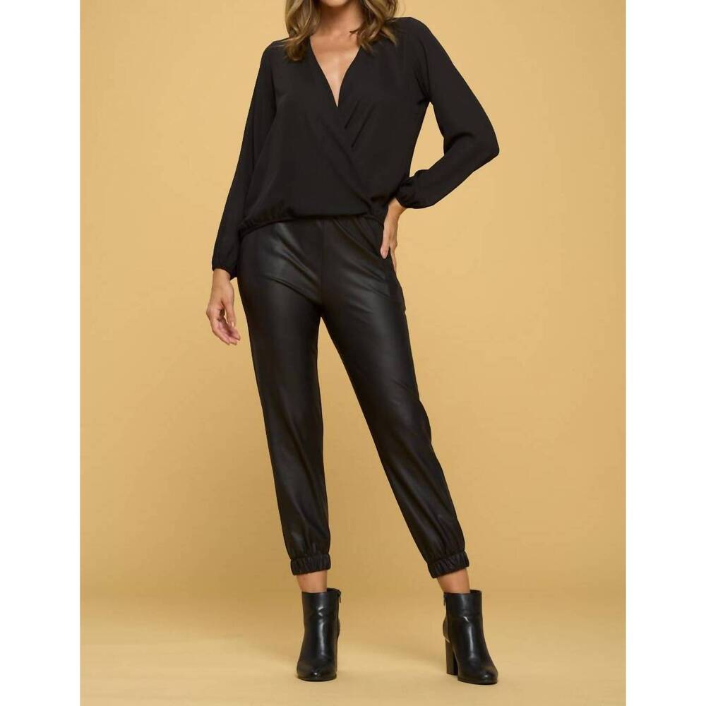 NEW RENEEC. solid long sleeve surplice top in black